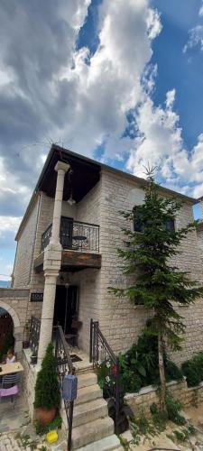 a large brick building with a tree in front of it at Soul boutique hotel in Monodendri