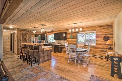 a kitchen and dining room with a table and chairs at Beautiful McCall Cabin Perfect for Families! in McCall