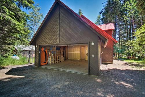 a large brown barn with a large door at Beautiful McCall Cabin Perfect for Families! in McCall