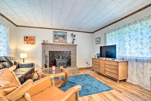 a living room with a couch and a fireplace at Pet Friendly Home with Hot Tub, Patio and Game Room! in Clayton