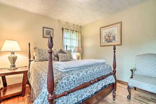 a bedroom with a bed and a chair at Pet Friendly Home with Hot Tub, Patio and Game Room! in Clayton
