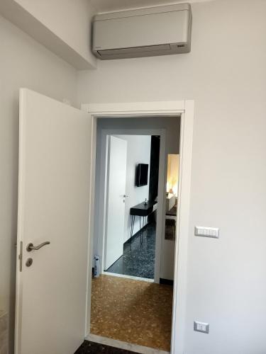 a hallway with a door leading to a room at Casa di Noemi - Seafront with parking in Savona