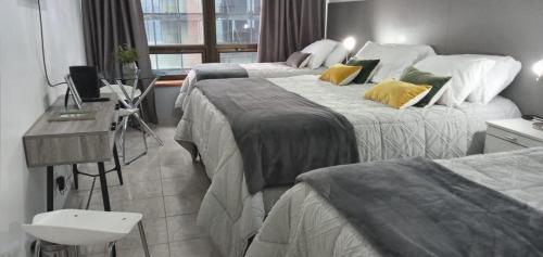 Una cama o camas en una habitación de CORAZON BUENOS AIRES