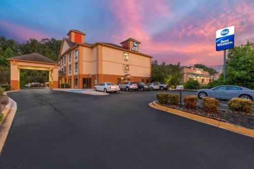 a building with cars parked in a parking lot at Best Western Seneca-Clemson in Seneca