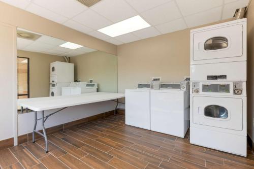 a laundry room with a table and washing machines at Best Western Seneca-Clemson in Seneca