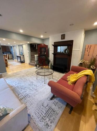 a living room with a couch and a fireplace at Northern Liberties Retreat in Philadelphia