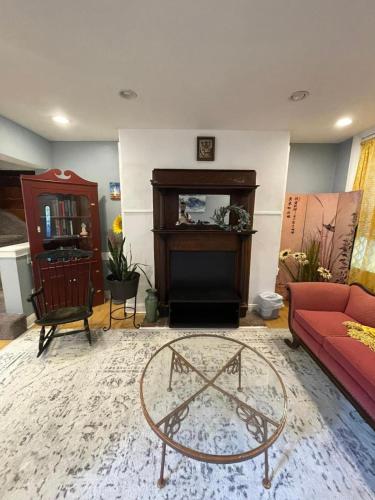 a living room with a couch and a table at Northern Liberties Retreat in Philadelphia