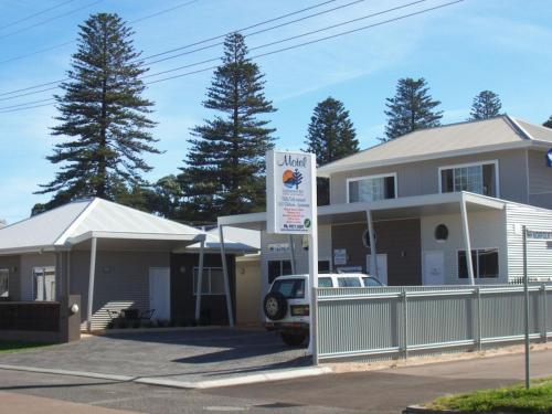 a view of a house with a sign in front of it at Clearwater Motel Apartments in Esperance