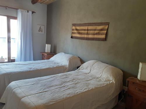 Letto o letti in una camera di Tierra Primitiva