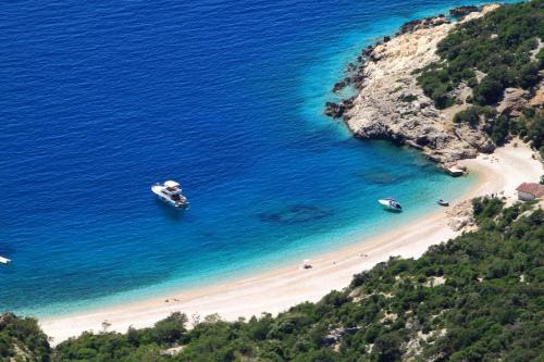 an aerial view of a beach with boats in the water at Apartments by the sea Cres - 13312 in Cres