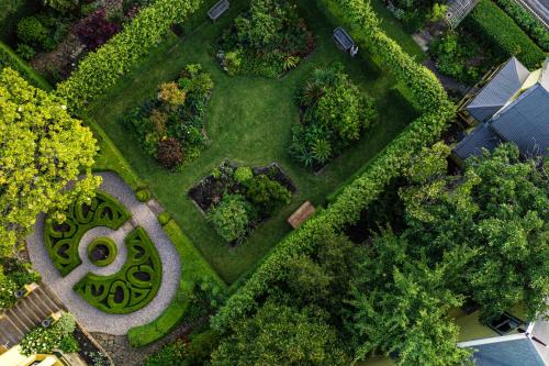 an overhead view of a garden with trees and bushes at The Corinda Collection in Hobart