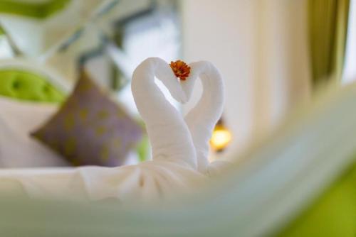 a white swan made to look like a heart at Harmonize Hotel Chiang Mai in Chiang Mai