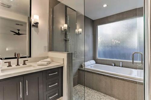 a bathroom with a tub and a sink and a shower at Quiet Luxury Estate w/ Heated Pool: Scottsdale in Scottsdale