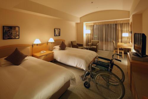 Televisyen dan/atau pusat hiburan di Royal Pines Hotel Urawa