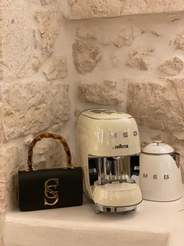 a white mixer sitting on top of a counter at Alesia Luxury Cave in Ostuni