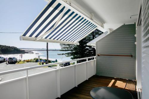 a balcony with a view of the ocean at The Surf Yamba in Yamba