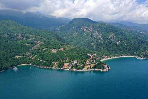 an island in the middle of a body of water at Apartments and rooms by the sea Medveja, Opatija - 2305 in Lovran