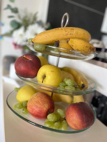 a three tiered display of fruit on a counter at Penzion Na Svahu in Cheb