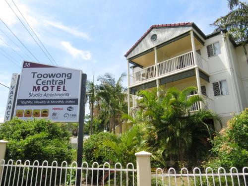 a sign in front of a building with a hotel at Toowong Central Motel Apartments in Brisbane