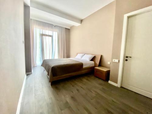 Aparthotel Kutaisiにあるベッド