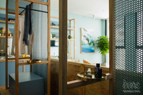 a bathroom with a sink and a mirror at Bare Han - Bare Boutique Stays in Da Nang