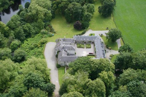 an aerial view of a house in the trees at Beaufort House in Beaufort