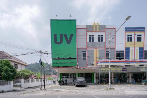 a large sign on the side of a building at Urbanview Hotel Gatot Subroto Lampung by RedDoorz in Geruntang