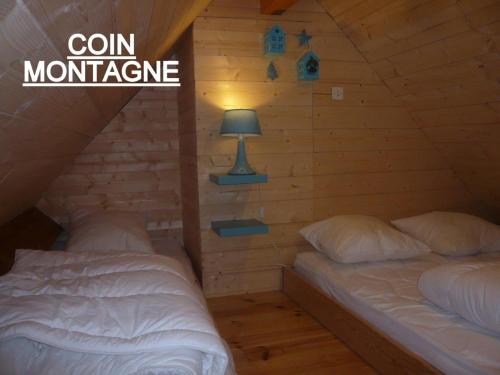 Posteľ alebo postele v izbe v ubytovaní APPARTEMENT CLAIR ET MODERNE AU CALME
