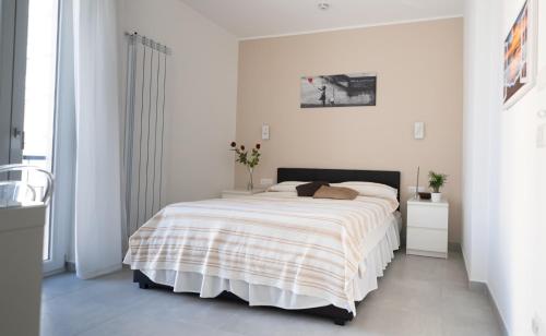 A bed or beds in a room at Mamuccia Rooms