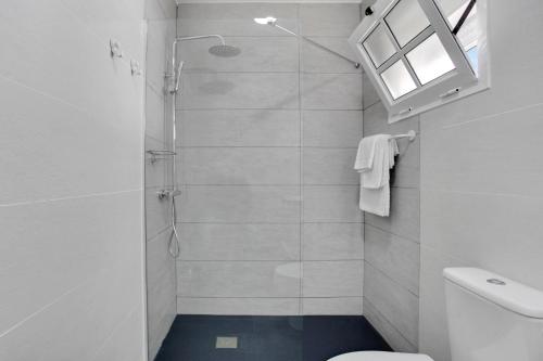 a bathroom with a shower and a toilet at Beautiful house with pool in Caleta De Fuste