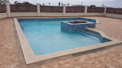 a swimming pool with a planter in the middle at de Felice in Mount Pleasant