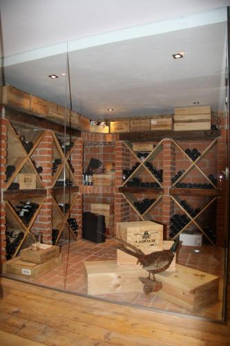 a room with a display of wine bottles at Apartments Blaickner in Neukirchen am Großvenediger