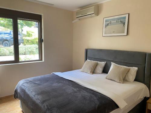 מיטה או מיטות בחדר ב-Dolce Vita Apartment