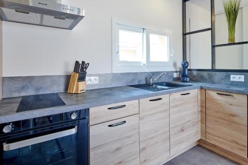 Kuchyň nebo kuchyňský kout v ubytování Casa Lhosa Villa patio 3 étoiles