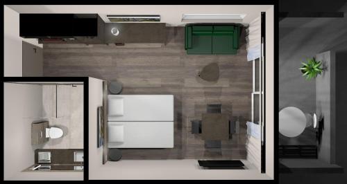 a floor plan of a kitchen with a refrigerator at Hotel Halond in Akureyri