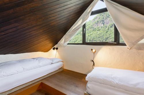 Postel nebo postele na pokoji v ubytování Rustici della Verzasca Ferien Wohnungen
