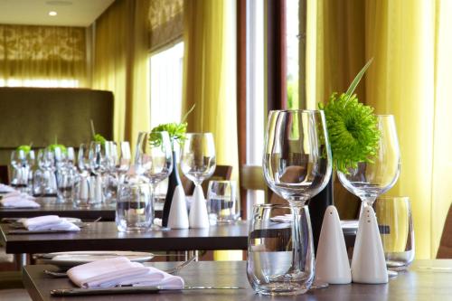 a group of wine glasses sitting on a table at Aubrey Park Hotel in Hemel Hempstead