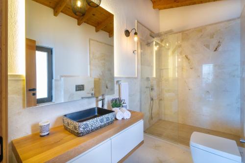 a bathroom with a sink and a shower at Water Edge 1 in Kaş