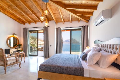a bedroom with a bed with a view of the ocean at Water Edge 1 in Kaş