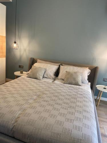 a bedroom with a large bed with white sheets and pillows at Chernomorets Apartment in Chernomorets