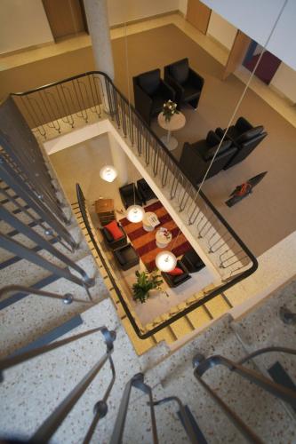 an overhead view of a living room with a table at Hotel Haus vom Guten Hirten in Münster