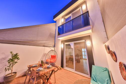 a room with a table and chairs in a house at Villa Ay in Kas