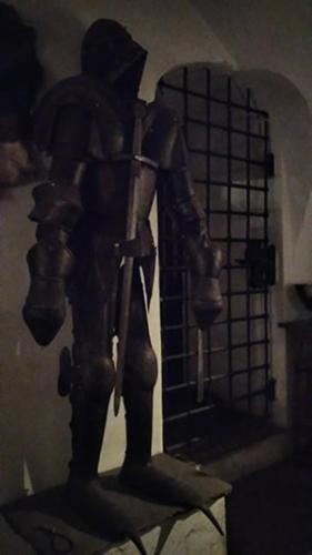 a statue of a mannequin sitting on a shelf at Rittergut Schloss Niederforchheim in Forchheim