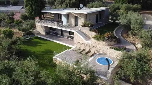 an aerial view of a house with a swimming pool at La Dependance Luxury Bed and Breakfast in Fondi