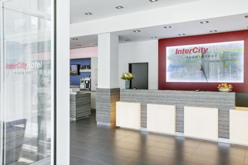 a reception area in a hospital with a sign that reads integrity hospital at IntercityHotel Ingolstadt in Ingolstadt