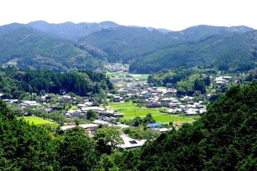 an aerial view of a small town in the mountains at Akizuki Niwa (Garden) House in Asakura