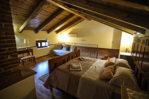 Un pat sau paturi într-o cameră la Dimora dei Greci 1