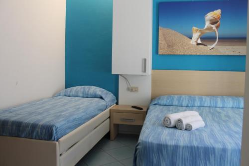 Кровать или кровати в номере Hotel Esperia