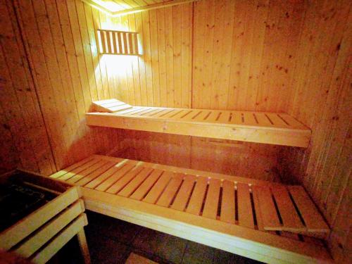an empty sauna with a light on top of it at Chez l'Eveline Chambre Libellule in Les Bois