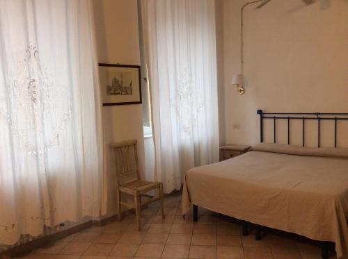 Postel nebo postele na pokoji v ubytování Albergo Cannon d'Oro